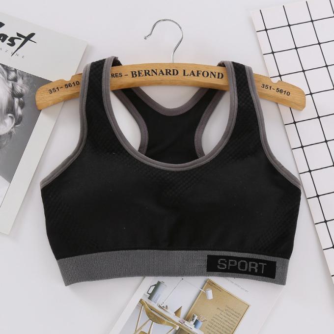 Camisetas sin mangas sólidas a prueba de choques de la Rápido-sequedad de Wicking de la ropa interior de la aptitud corriente de las mujeres del sujetador de los deportes de la moda del color de Macaron