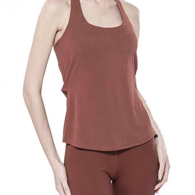 Los deportes al por mayor conceden la ropa de la aptitud de las mujeres que funciona con belleza superior detrás se divierten el top flojo superior de la yoga con el sujetador