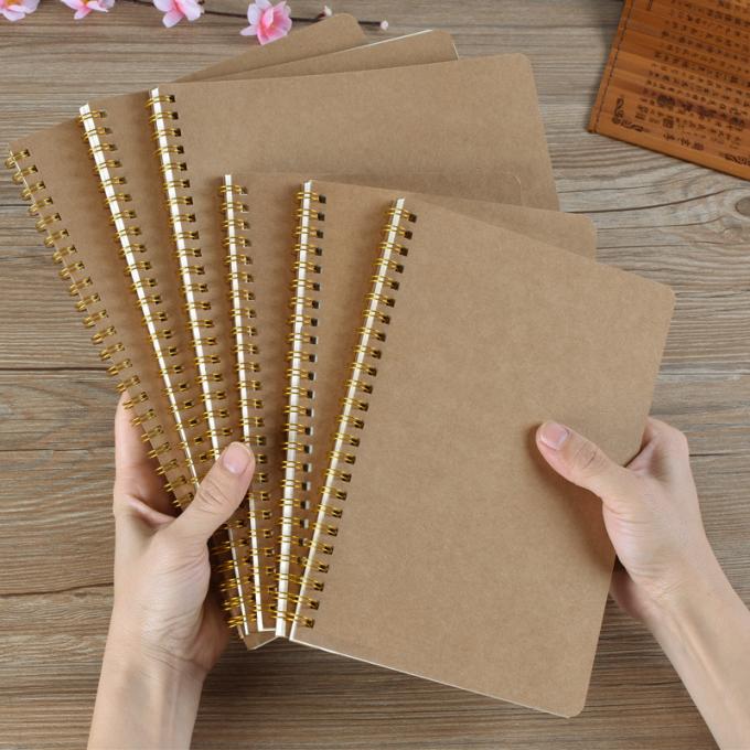 El enrejado de encargo reciclado al por mayor del Hardcover alineó el cuaderno espiral de Offic A5 Kraft del espacio en blanco