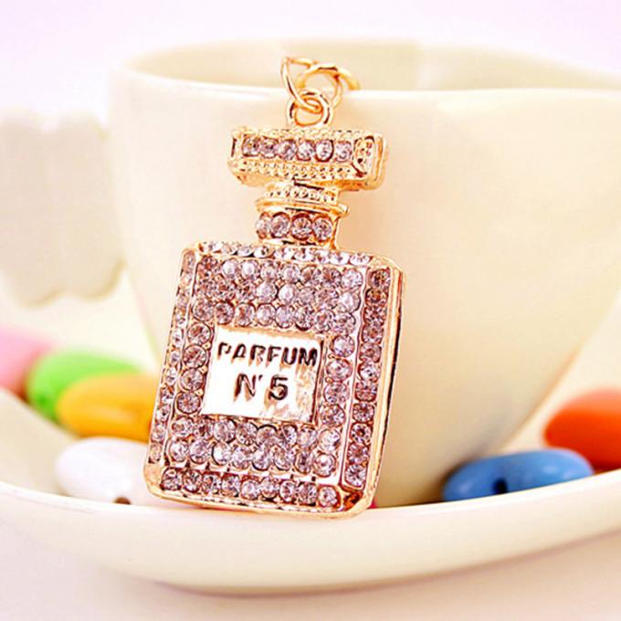 Las señoras Diamante-tachonadas creativas perfuman el metal femenino Crystal Keychain del diamante artificial de los accesorios del bolso de la cadena dominante de la botella