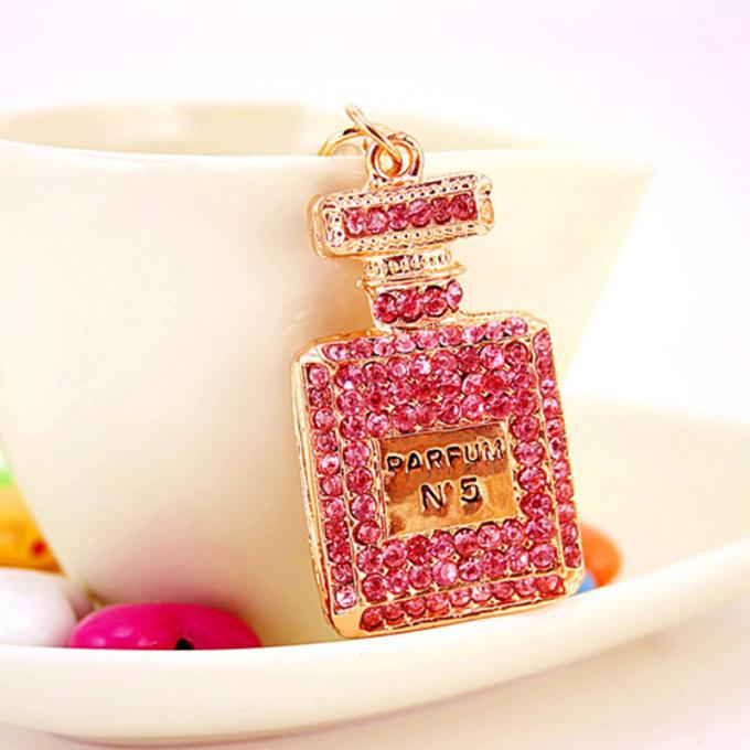 Las señoras Diamante-tachonadas creativas perfuman el metal femenino Crystal Keychain del diamante artificial de los accesorios del bolso de la cadena dominante de la botella