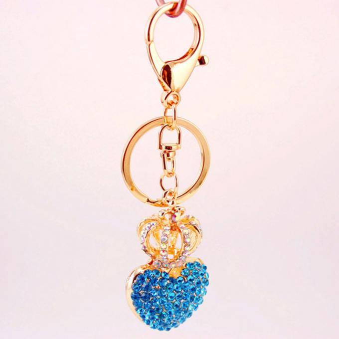 Las señoras Diamante-tachonadas creativas perfuman el metal femenino Crystal Keychain del diamante artificial de los accesorios del bolso de la cadena dominante de la botella