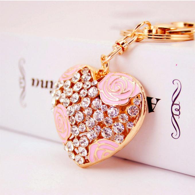 Las señoras Diamante-tachonadas creativas perfuman el metal femenino Crystal Keychain del diamante artificial de los accesorios del bolso de la cadena dominante de la botella
