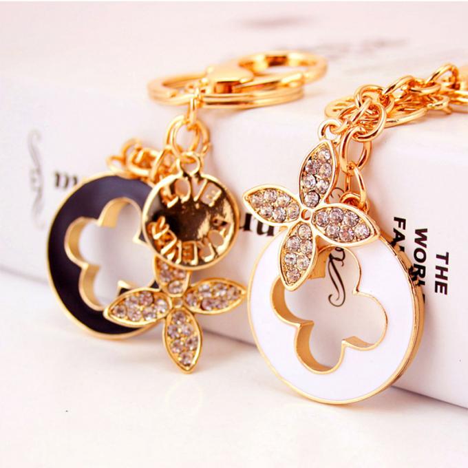 Las señoras Diamante-tachonadas creativas perfuman el metal femenino Crystal Keychain del diamante artificial de los accesorios del bolso de la cadena dominante de la botella