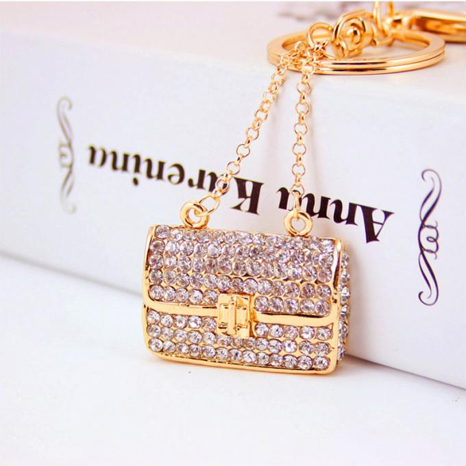 Las señoras Diamante-tachonadas creativas perfuman el metal femenino Crystal Keychain del diamante artificial de los accesorios del bolso de la cadena dominante de la botella
