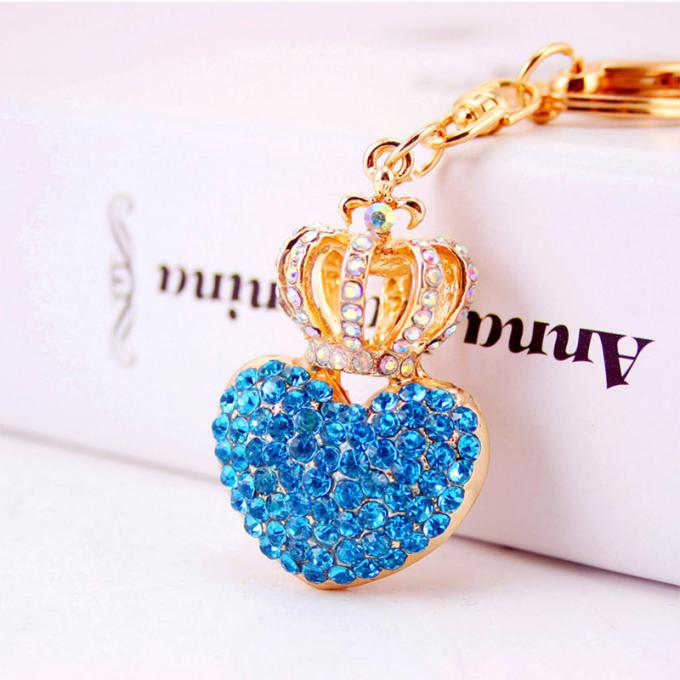 Las señoras Diamante-tachonadas creativas perfuman el metal femenino Crystal Keychain del diamante artificial de los accesorios del bolso de la cadena dominante de la botella