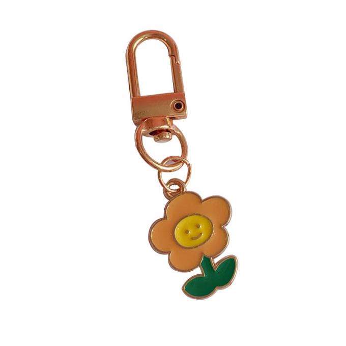 El bolso pendiente del conejo de la cadena dominante del pequeño metal al por mayor de la flor adorna los llaveros lindos de la historieta de los accesorios para las mujeres